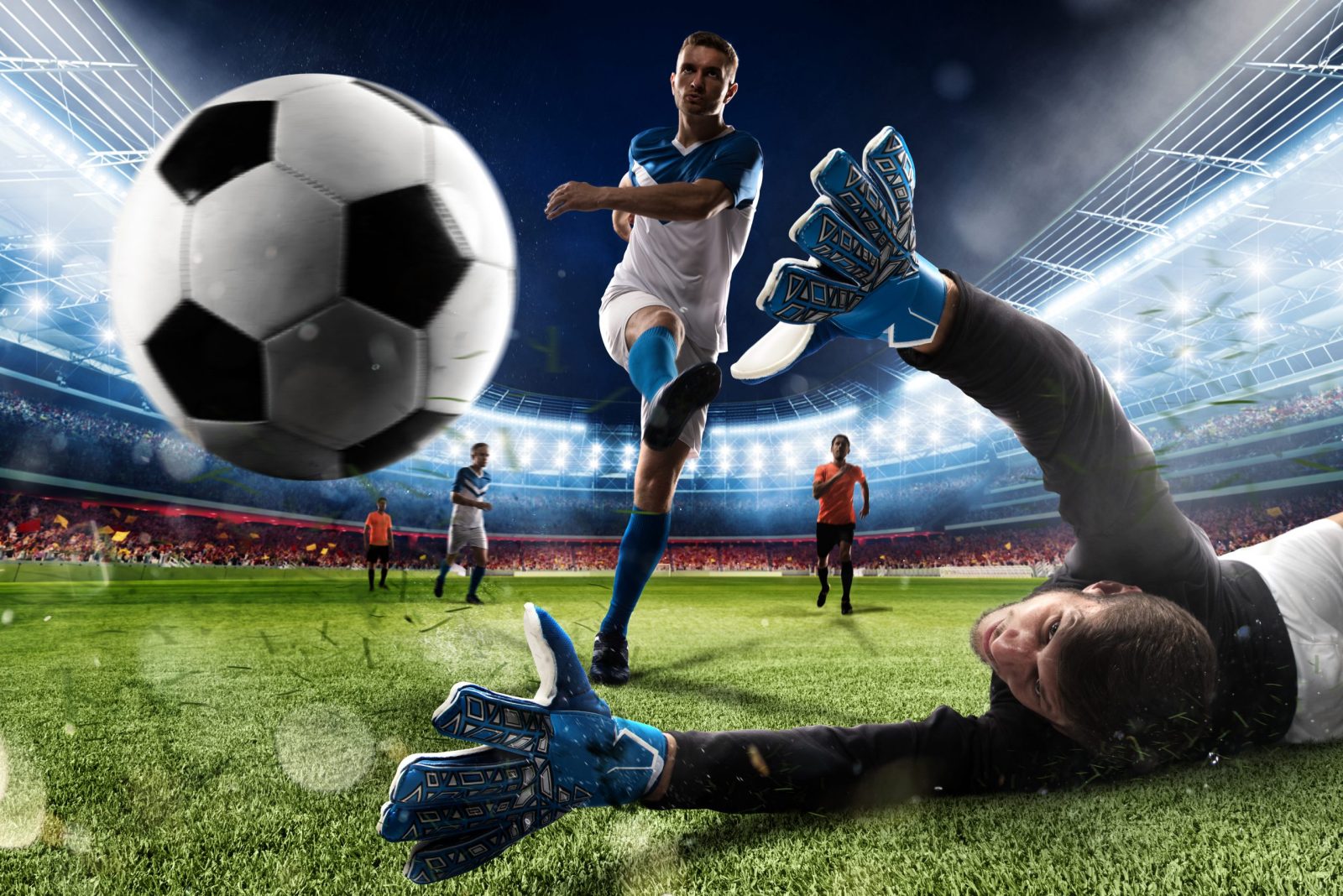 goalkeeper kicks ball stadium during football game scaled